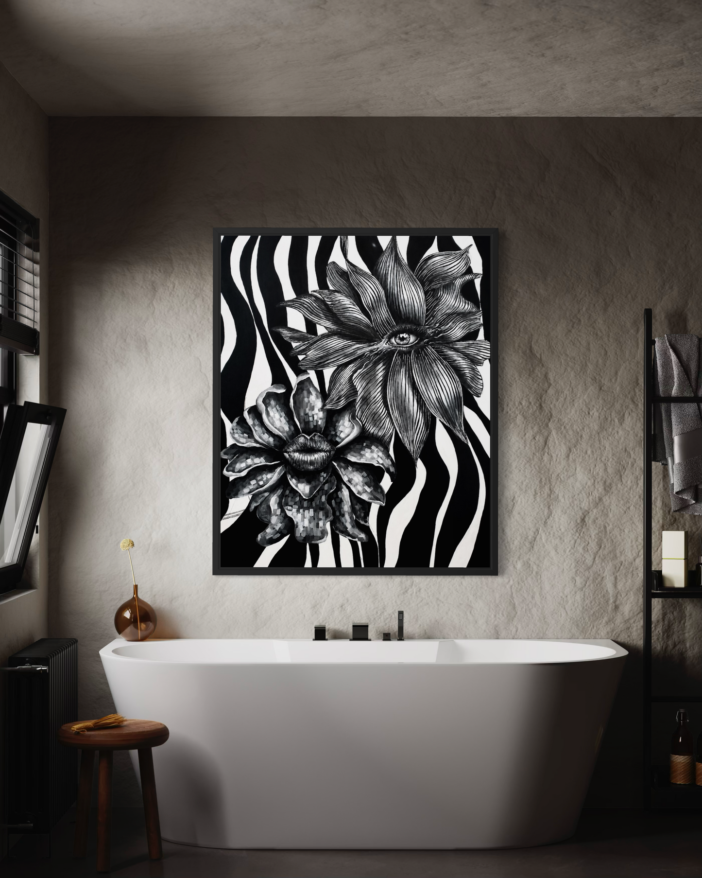A framed black and white floral print with zebra-like stripes hangs on a textured gray bathroom wall above a white freestanding bathtub.