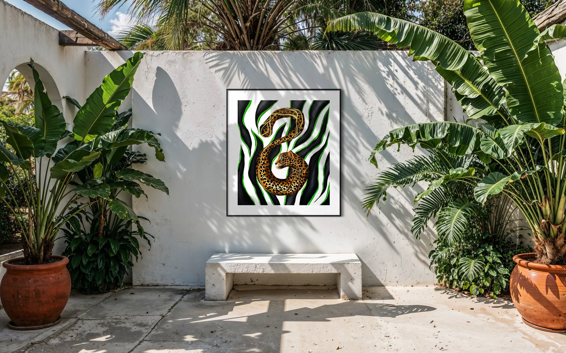 Framed Instinct and Becoming art print with a green and black zebra pattern and golden coiled snake, displayed in a tropical courtyard.